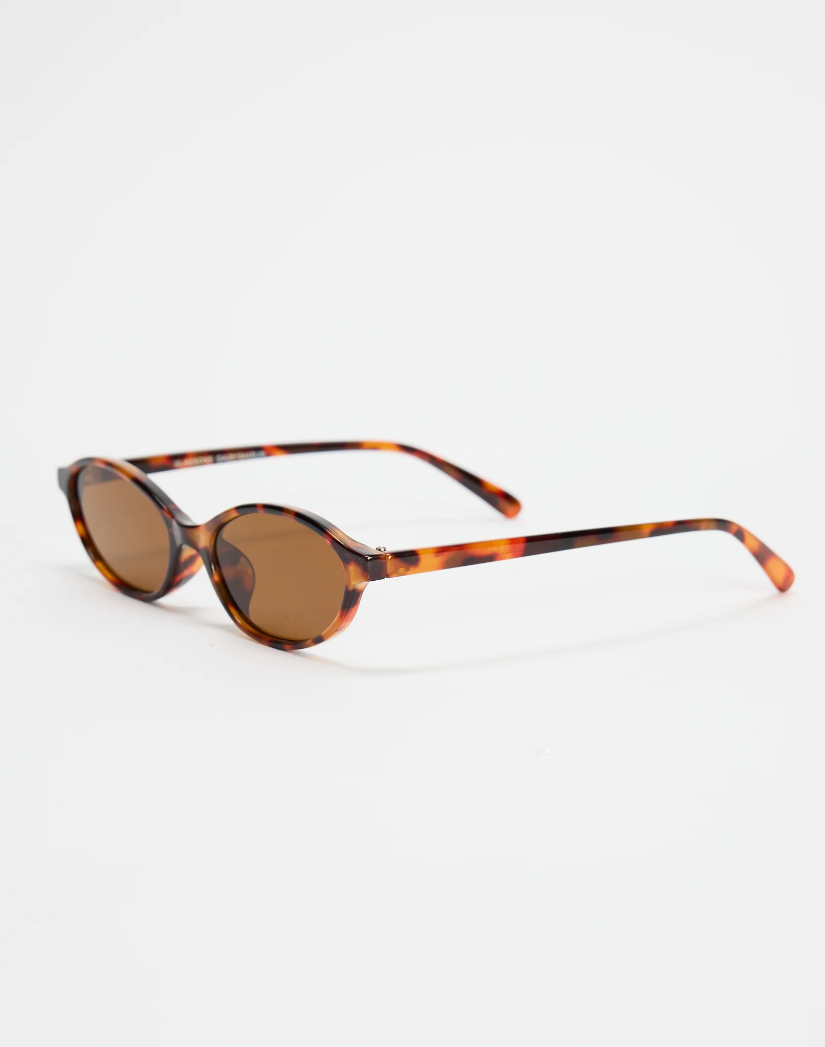 Thin Oval Sunglasses Oval Sunglasses in Tort